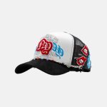 Gorra Dandy Hats Rocket Pop trucker blanca y negra con parches de crochet, vista lateral izquierda